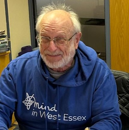 Man wearing blue Mind in West Essex hoodie
